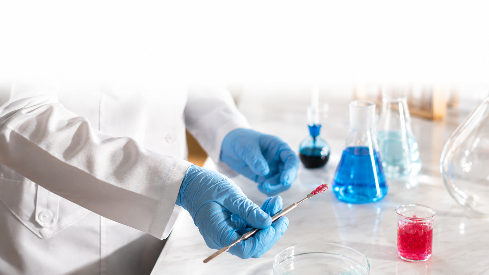 Pharmaceutical science laboratory with pipettes and test tubes, bright clean research environment, deep blue lighting accents